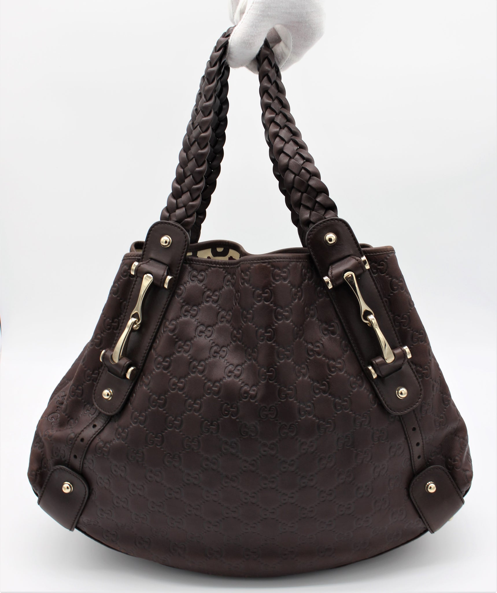 Braided leather shoulder bag with braided handles